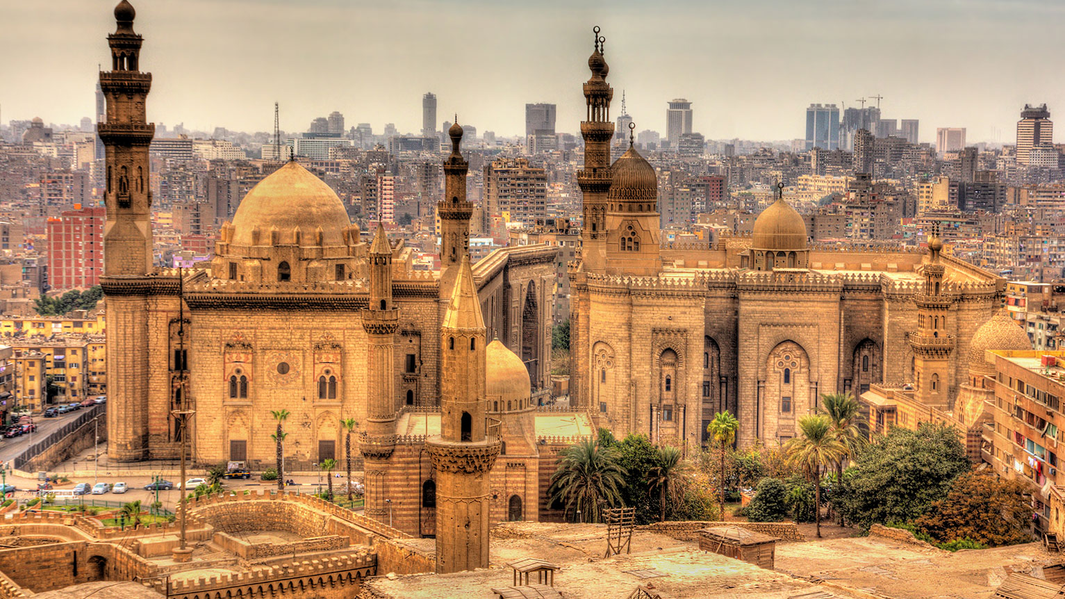 Experience the rich heritage and bustling streets of Cairo, Egypt with Lionsgate Travel, featuring landmarks like the Egyptian Museum and vibrant bazaars.